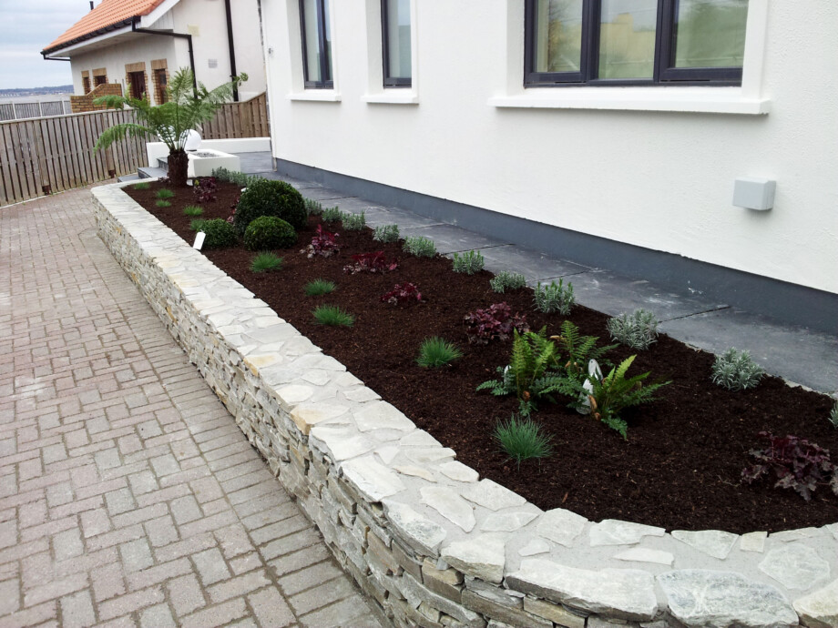 3 main. Bayside. Natural stone clad flowerbeds